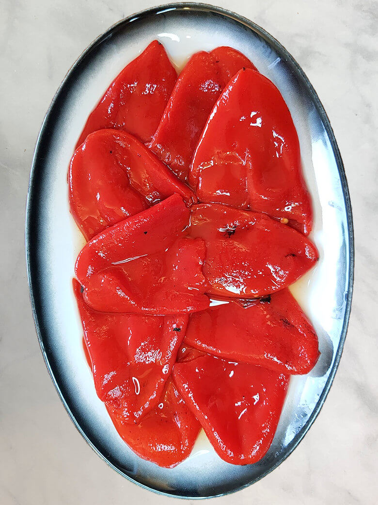 Plate with roasted and peeled red bell peppers