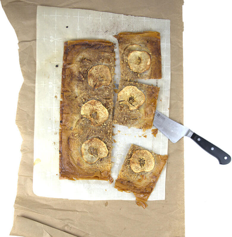 Top down picture of cut apple pecan phyllo crisp with knife