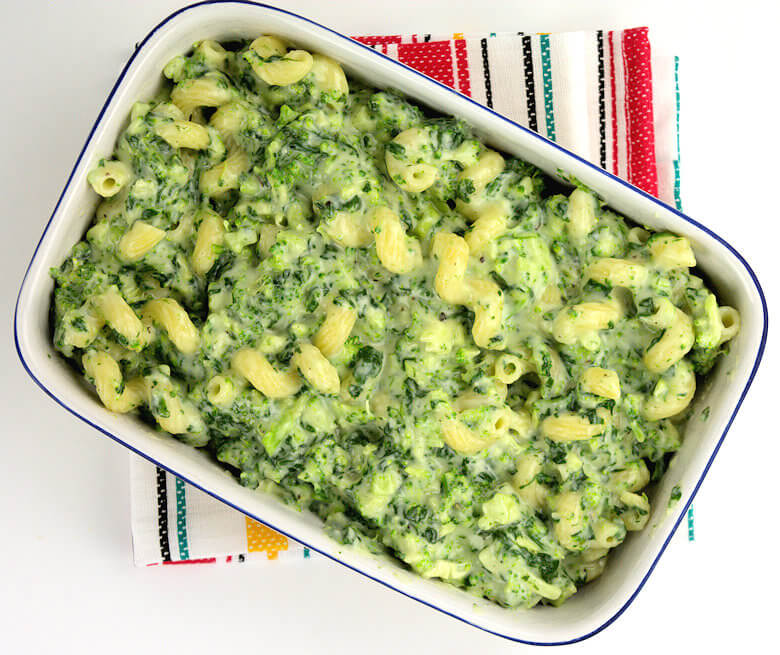 Top down picture of unbaked Broccoli and Spinach Mac & Cheese