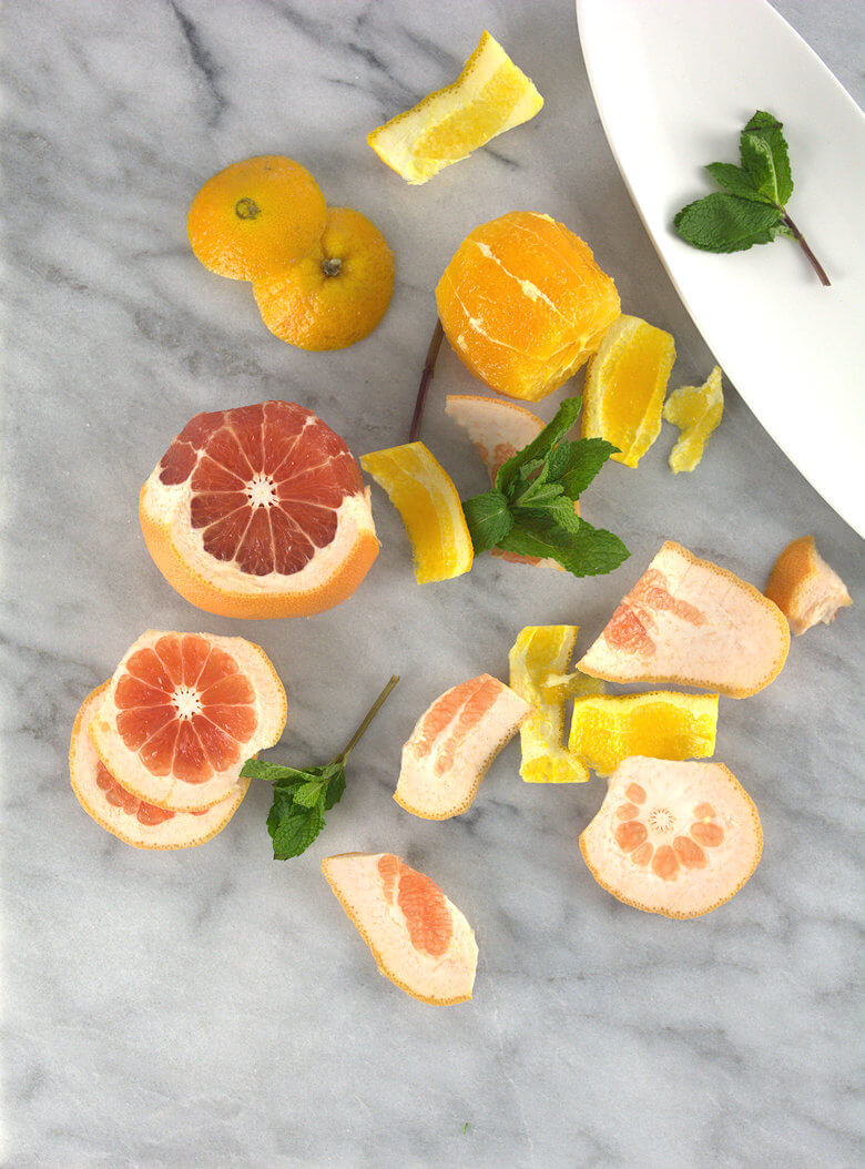 Picture showing cut grapefruits and oranges