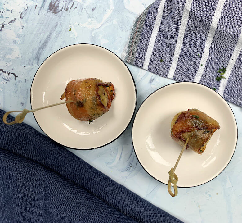 Bacon wrapped potatoes with cocktail picks.