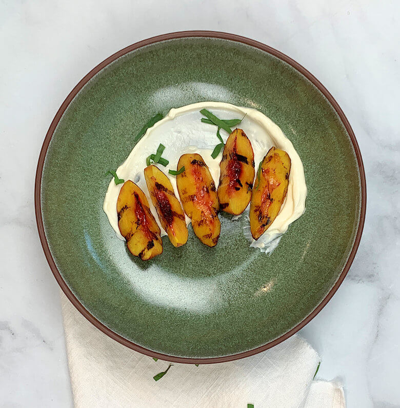 Green bowl with Grilled Peaches on Mascarpone Cream