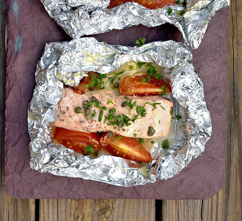 Close up picture of 1 salmon fillet in foil