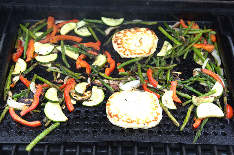 Roasting vegetables and halloumi on barbecue