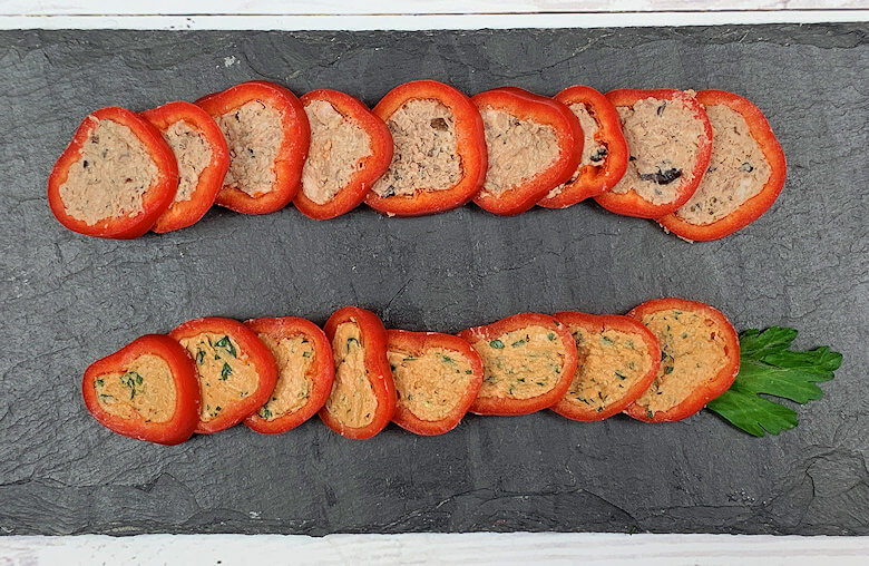 Pate stuffed pepper slices on slate board