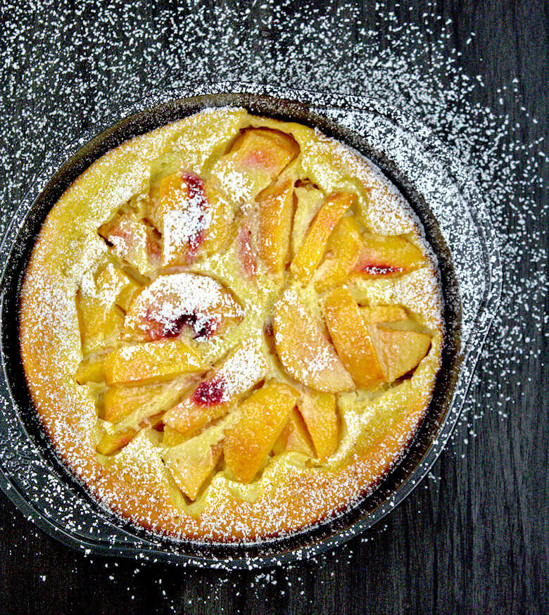 Picture Peaches n Cream Clafouti covered with powdered sugar