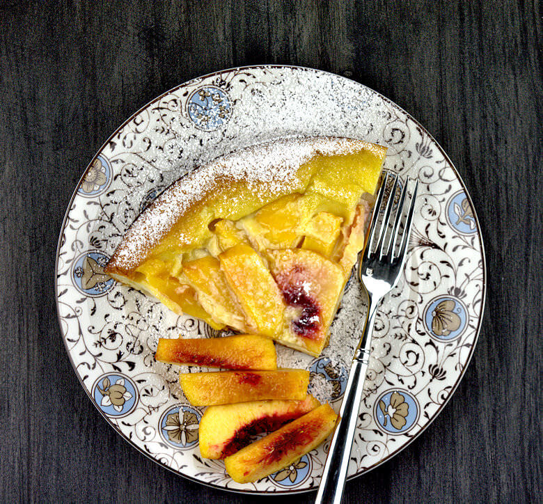 Picture of dessert plate with wedge of Peaches n Cream Clafouti