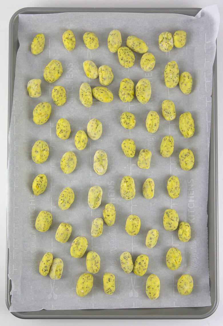 Picture of uncooked gnocchi on baking sheet