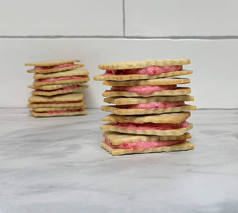 Two stacks of Raspberry Petit Beurre Sandwich Cookies