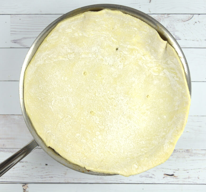 Dough covered upside down tart before baking