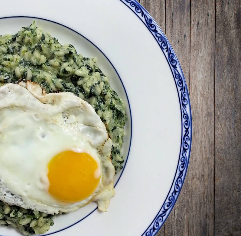 Close up of Spinach Risotto with Fried Egg