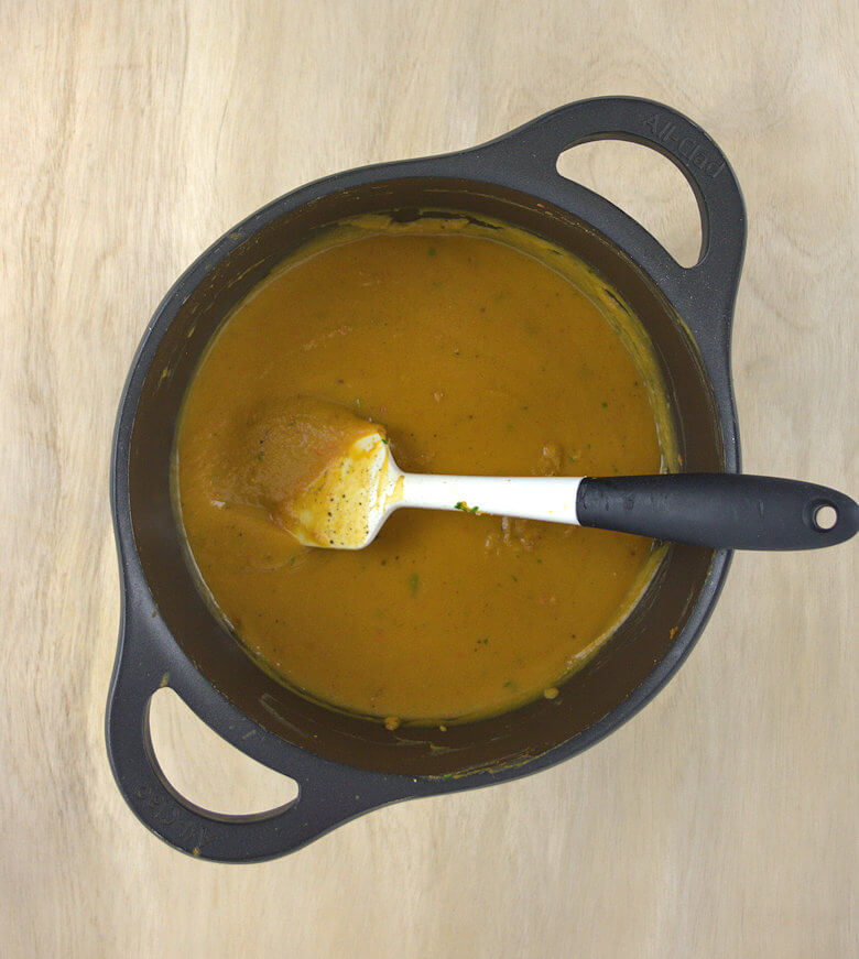 Preparing soup in large pot