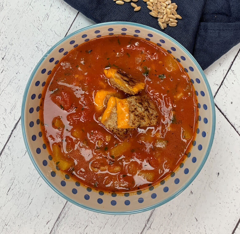 Bowl with Tomato Farro Soup with Grilled Mimolette Croutons