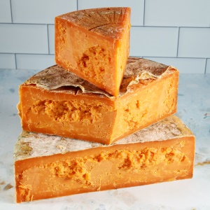 Picture of aged red leicester cheese clothbound